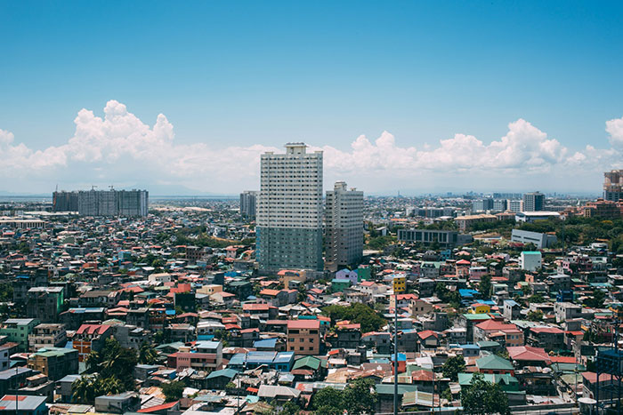 cityscape with few tall buildings amidst nearby residences